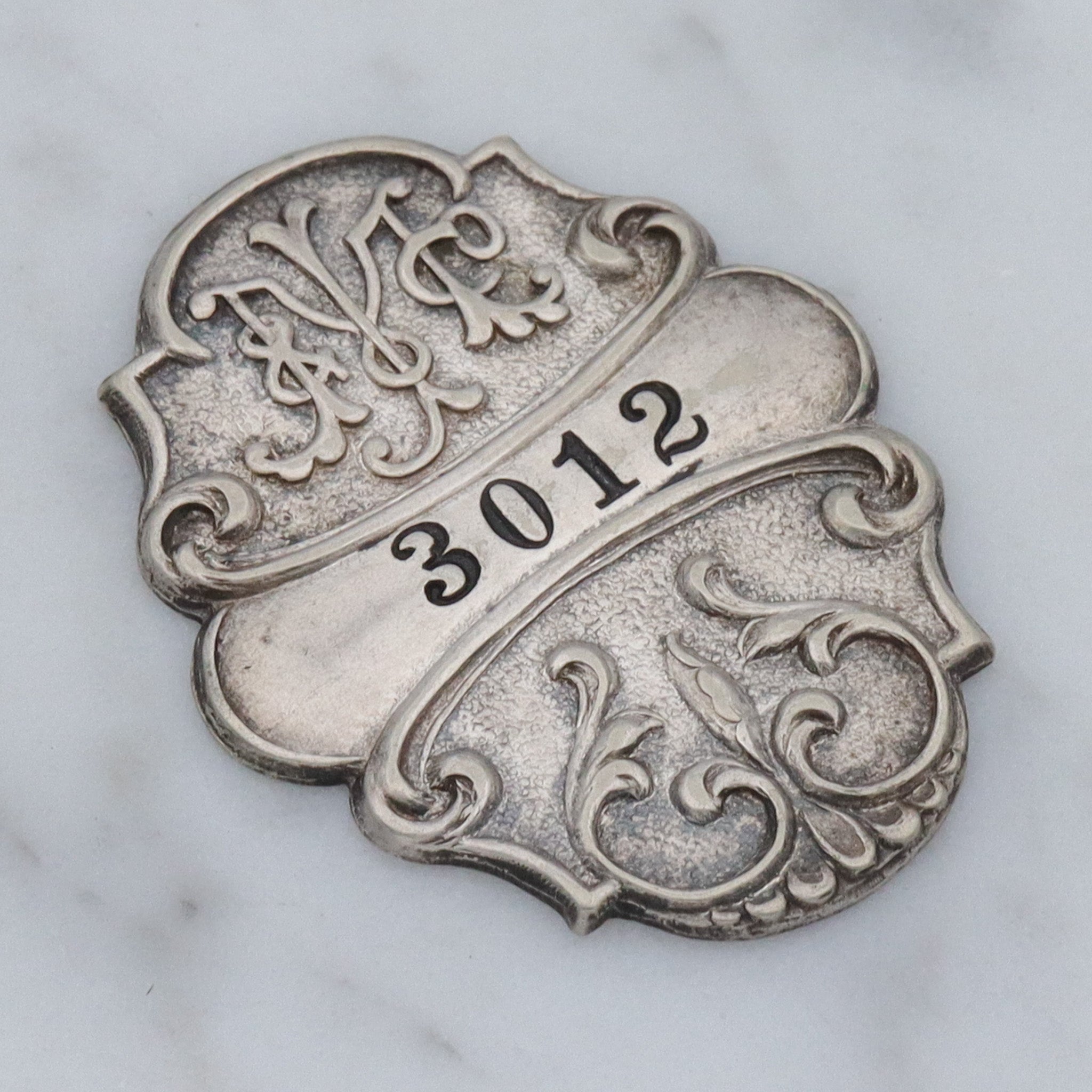 Antique Art Nouveau silver plated department store charge coin